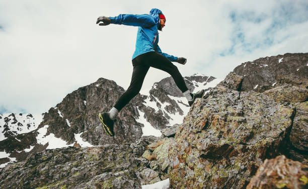 travel man running in mountains adventure lifestyle endurance concept active vacations skyrunning sport - nordic running imagens e fotografias de stock