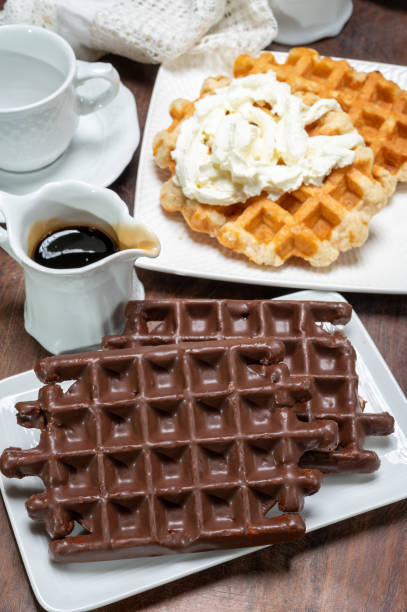 istock Tasty Belgian dessert, Brussels waffles with chocolade and whipped cream 1209673024