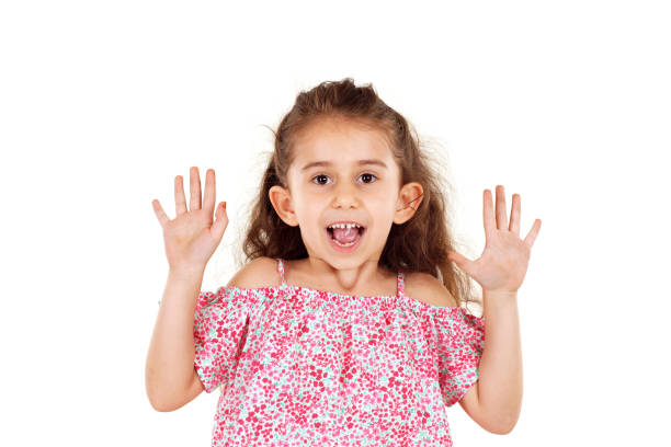 istock excited little girl on white background 1209675135