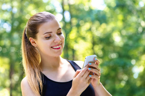 istock Young woman using her phone 1209675169