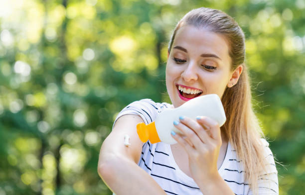 istock Young woman with sunscreen 1209675178