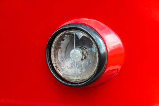 istock broken old round headlight of red tram 1209676626