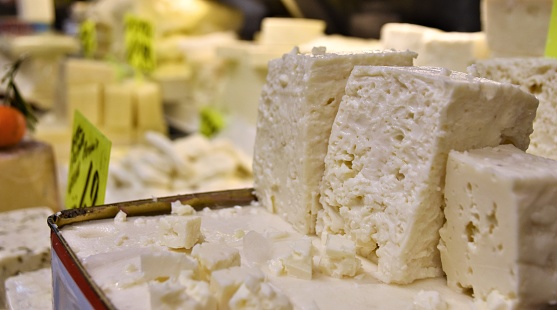 A stable in mediterranean die three cubes of traditional white Feta Cheese are displayed in Turkish market