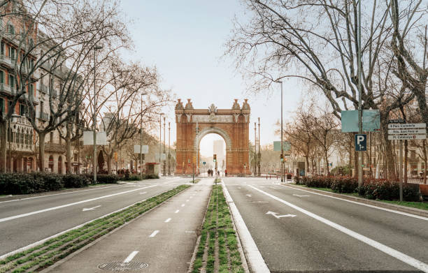 Barcelona sunrise at the street Barcelona sunrise at the street arc de triomf barcelona stock pictures, royalty-free photos & images