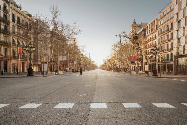 Barcelona sunrise at the street Barcelona sunrise at the street empty road stock pictures, royalty-free photos & images