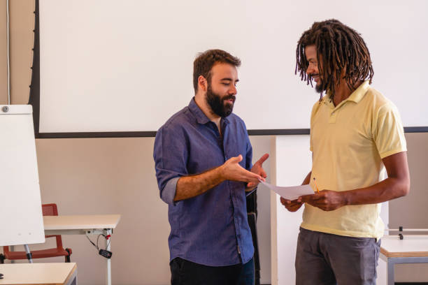 istock Student and a teacher in a classroom. 1209683289