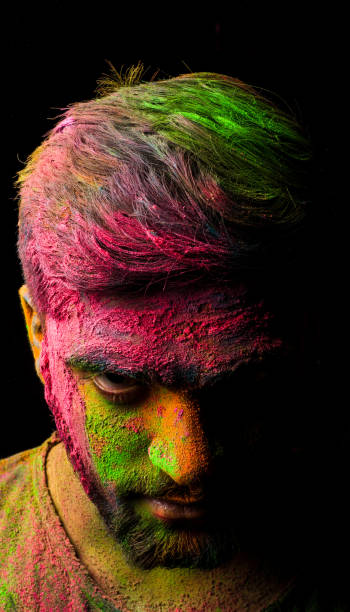 istock man in holi colors 1209683604