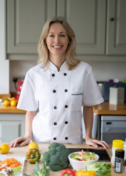 istock Professional cook working at a house and cooking dinner 1209687560