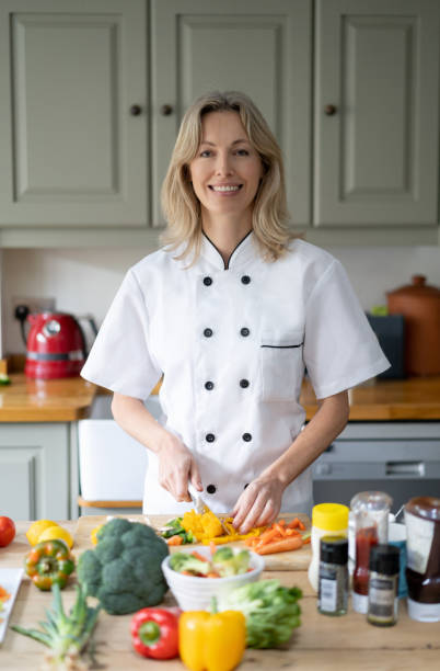 Happy personal chef working at house cooking healthy meals