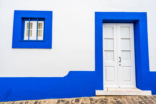 Traditional white houses with blue stripes, Portugal