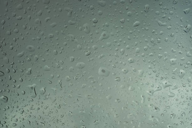 istock Clean water drops on glass after rain 1209687829