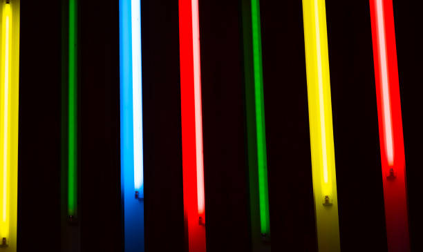istock colorful fluorescent lamp on black wall 1209689618