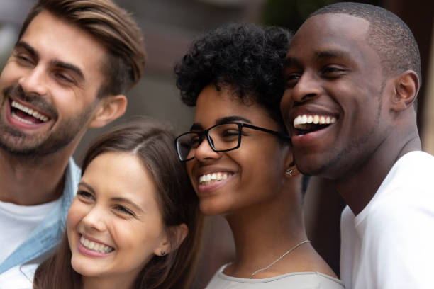 istock Smiling multiracial millennial friends posing for picture together 1209690281
