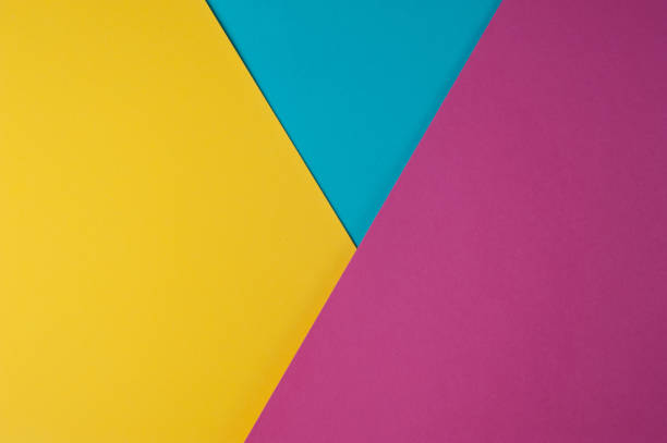 istock Abstract multi colored paper background - yellow, blue, pink colors 1209693852