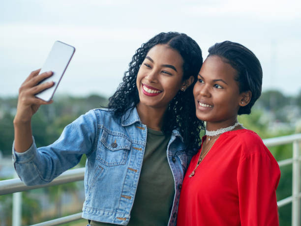 istock Two girls taking a selfie 1209693947