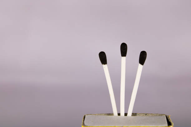 istock A creative concept of a wax match box with with stick and black head 1209695787