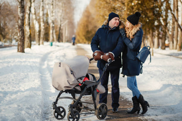 istock Family in a winter park 1209698761