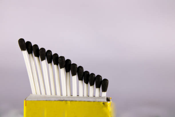 istock A creative concept of a wax match box with with stick and black head 1209699989