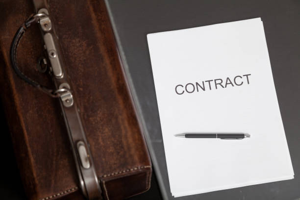 istock Contract and leather carpetbag close-up 1209700560