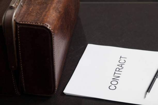 istock Contract and leather carpetbag close-up 1209700581