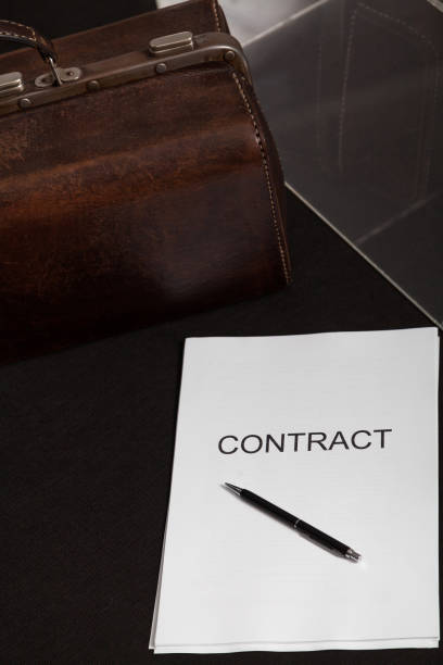 istock Contract and leather carpetbag close-up 1209700598