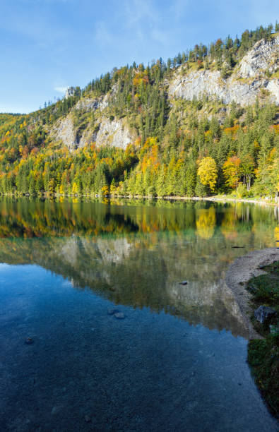 istock Peaceful autumn Alps mountain lake with clear transparent water and reflections. Langbathseen lake, Upper Austria. 1209704021