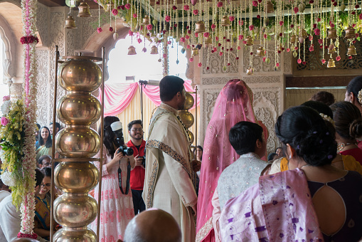 Mumbai,India-January 31,2020:hindu wedding bride and groom celebrating wedding event with flower decorations
