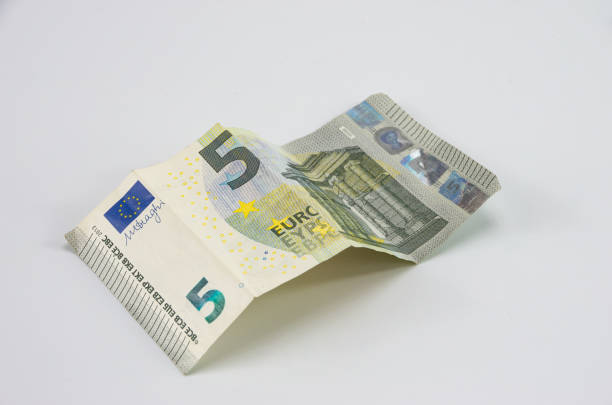 istock Five euro for the euro area on white background 1209704167