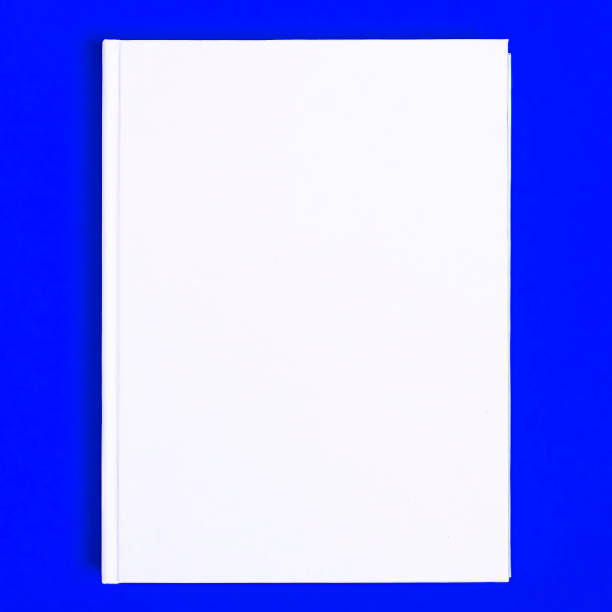 istock Mockup of closed blank square book at white textured paper background 1209707536
