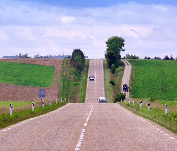 istock long straight road in the countryside 1209709375