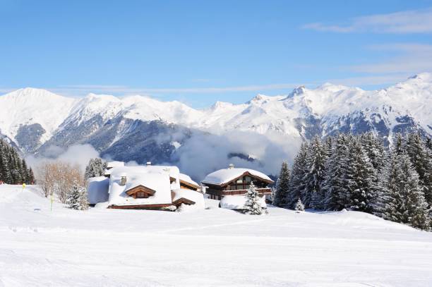 istock Winter  view with chalet and ski slope 1209711795