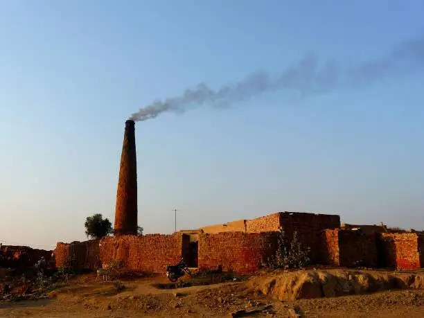 Smoke emission from a brick kiln chimney increasing air pollution
