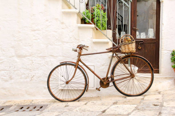 istock An old, rusty bike used as decoration with flower basket 1209714150