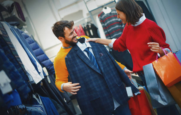 istock Young couple buying clothes at a mall. 1209714731