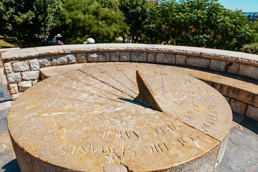 Cambrils Spain August 8, 2013 . Roman amphitheatre of Tarragona, Spain. Tourists take pictures of the sundial. An ancient historical tourist attraction of Catalonia.