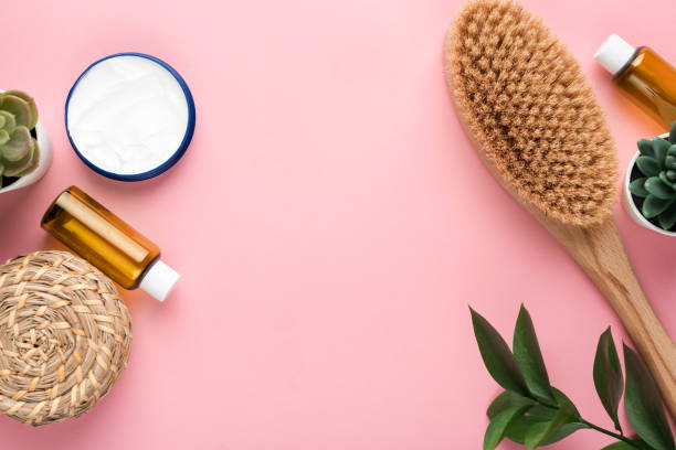 istock Beauty and spa cosmetic objects flat lay on pink background 1209716388