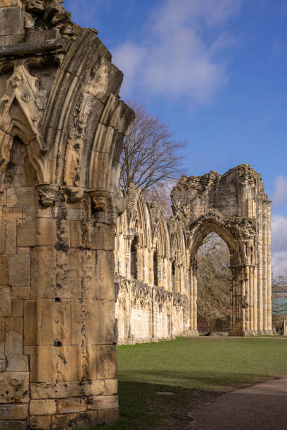 York, UK. February 26, 2020.  The ancient St Mary's Abbey in York.  The ruins of an archway stand in the foreground and a tall arch is in the distance.