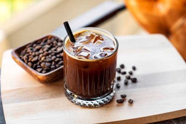istock Cold brew coffee with milk and ice cubes in glass 1209718814