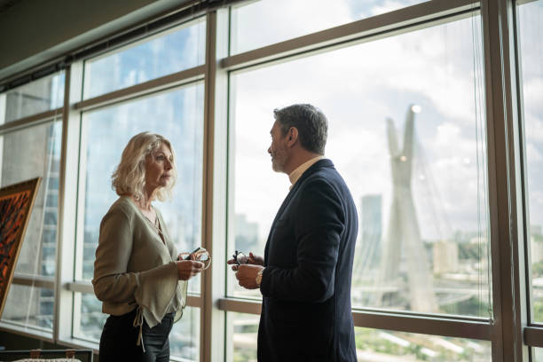 istock Business partners talking at office 1209722069
