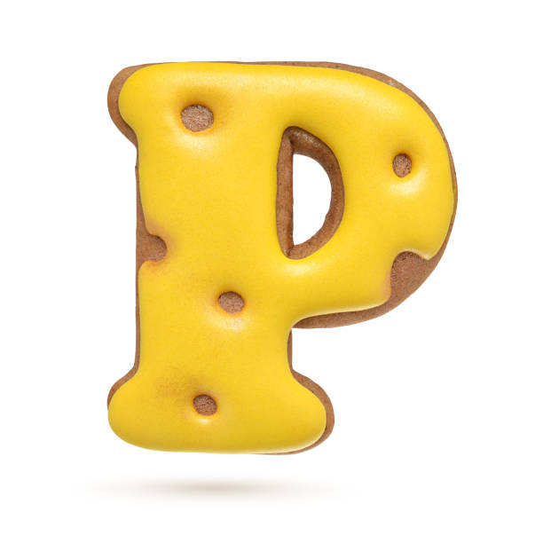 istock Capital letter P yellow gingerbread biscuit isolated on white. 1209722655