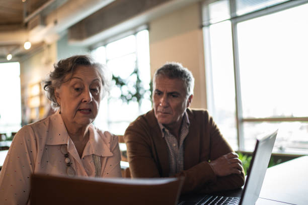 istock Business partners using laptop on a meeting at office 1209722755