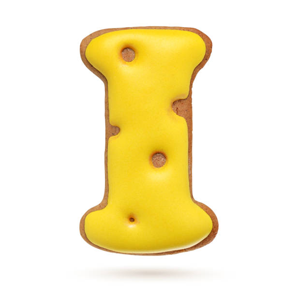 istock Capital letter I yellow gingerbread biscuit isolated on white. 1209723610