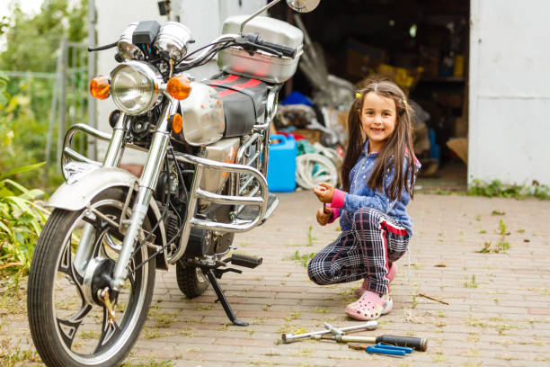 istock motorcycle repair child 1209724761