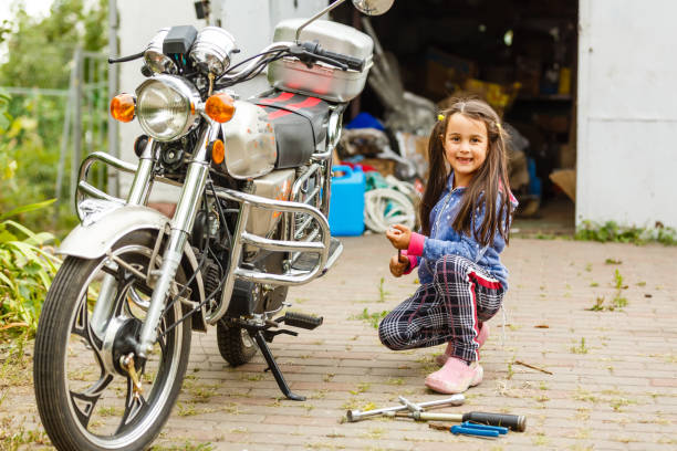 istock motorcycle repair child 1209724803