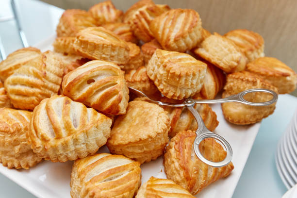 cakes on a plate and tongs for cakes