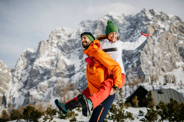 istock Young couple having fun on snow 1209732203
