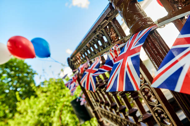 istock British Union Jack bunting flags against blue sky 1209732750
