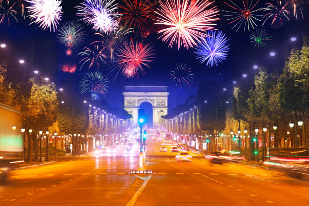 Arc de triumph at Paris and fireworks in night sky Arc de triumph in Paris, Champs Elysee boulevard and fireworks in the night sky, France bastille day stock pictures, royalty-free photos & images