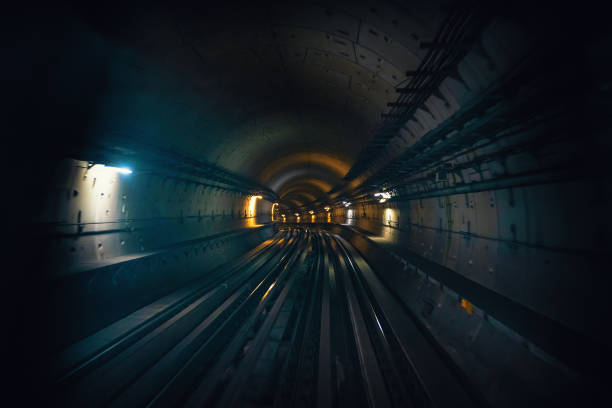istock Dubai metro tunnel in blurred motion, view from first wagon, subway tracks 1209736835