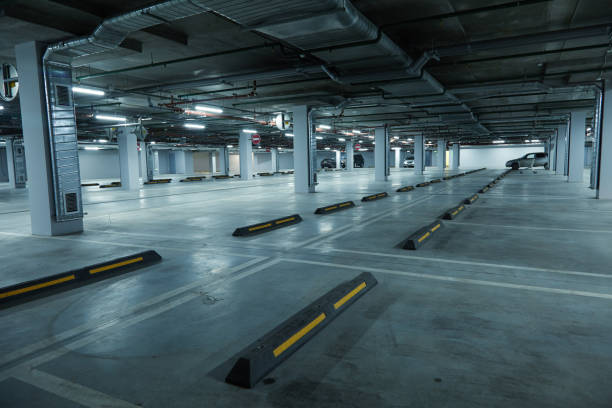 istock Horizontal image of empty underground parking lot 1209738226